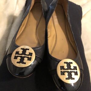 Tory Burch Black and Gold Loafers with Logo Medallion